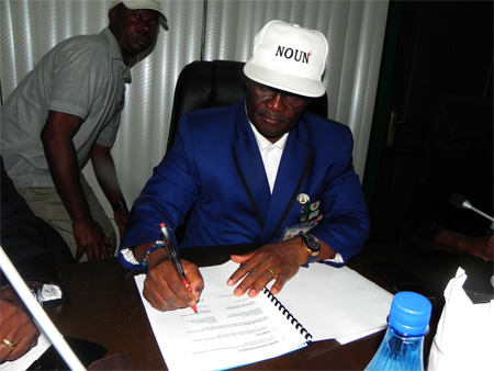 The Vice Chancellor Prof. Vincent A. Tenebe signing the NOUN-IPMA Memorandum of Uniderstanding